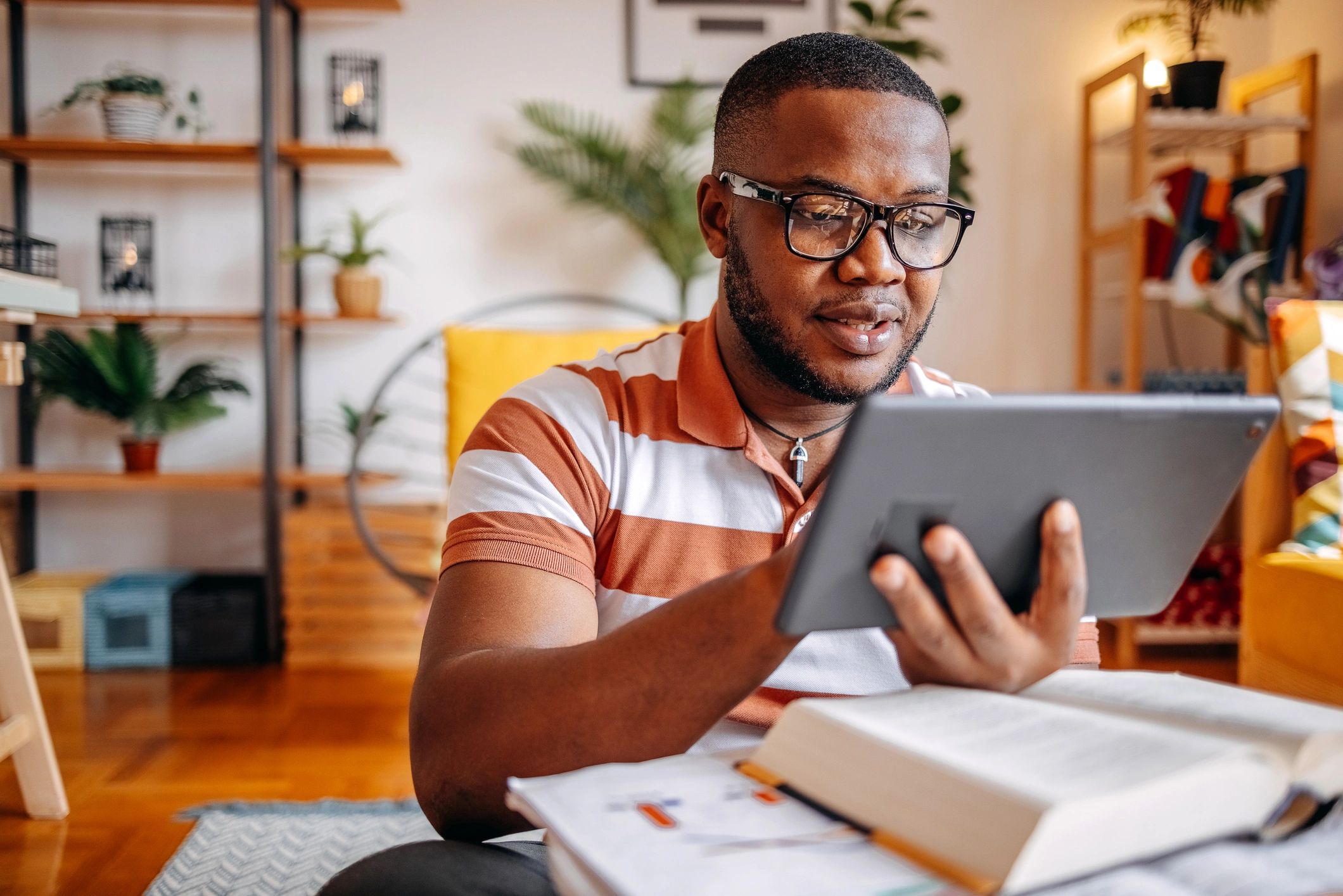Reader using a tablet at home